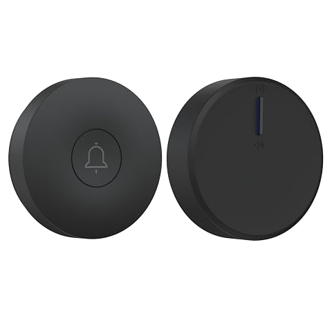 Bouton de sonnette rond noir et récepteur branché près d’une porte claire